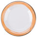 A close up of a Kanello white melamine plate with a wide white rim and an orange edge.