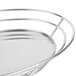 A Clipper Mill stainless steel oval basket with a raised bottom and handle.