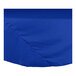 A royal blue cloth table cover on a round table.