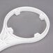 A white plastic C Pure filter wrench with a circular design.
