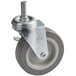 A grey metal swivel caster with a metal wheel and nut.