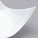 A white plastic tray with a curved edge.