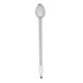 A white object with a silver hooked handle and a silver spoon.