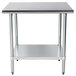 An Advance Tabco stainless steel work table with a galvanized undershelf.