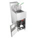 A Dean natural gas floor fryer with the door open and two baskets inside.