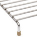 A stainless steel Continental Refrigerator garnish rack with metal rods and two legs.