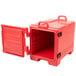 A red plastic container with a door open.
