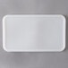 A white plastic lid for a Carlisle rectangular food storage container.