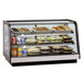 A Federal Industries CRR3628 countertop display case full of food.