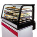 A Federal Industries countertop display case with food in it.