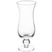 An Acopa hurricane glass with a small base on a white background.
