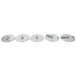 A Robot Coupe 5 Food Processor Disc Kit, a row of circular silver discs with holes on a white background.