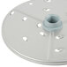 A white circular Robot Coupe food processor disc with holes.