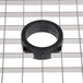 A black rubber ring on a white Hobart dicing grid.