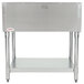An Eagle Group stainless steel open well hot food table with a shelf.