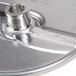 A circular metal Hobart slicing plate with a blade.