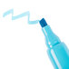A close-up of a blue Universal chisel tip highlighter.