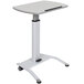 A white Luxor pneumatic adjustable height lectern with wheels.