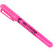 A pink pen with black writing on it.