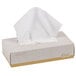 A white tissue box with a gold lid containing white tissue paper.