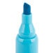 A close-up of a Universal blue chisel tip highlighter.