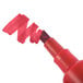 The chisel tip of a red Avery Marks-A-Lot permanent marker.