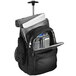 A black Samsonite top loader rolling laptop case / backpack with a laptop and other items inside.