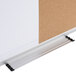 A close-up of a Universal white write-on dry erase board with a white metal strip at the top.