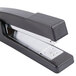 A black Universal Classic desktop stapler with silver metal handles.