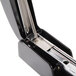 A Universal black metal desktop stapler.