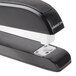 A Universal black executive desktop stapler with white plastic parts.