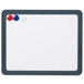 A white Universal magnetic melamine dry erase board with red, white, and blue magnets.