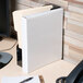 An Avery white heavy-duty non-stick view binder with 1" slant rings on a desk.