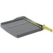 A grey Swingline paper cutter with a green handle.