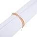 A rolled white paper with a Universal beige rubber band around it.