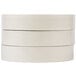 A stack of three rolls of white Universal general purpose masking tape.