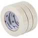 A Universal masking tape roll with a white label and black text on a white background.
