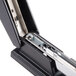 A black Universal full strip stapler with a metal frame.