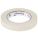 A roll of Universal beige masking tape with a white label.