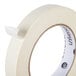 A roll of Universal general purpose masking tape with a white label.