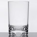 A clear plastic double rocks glass with a rim.