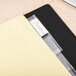 A file folder with Avery 8-tab dividers and a label on it.