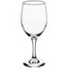 An Acopa clear wine glass with a stem.