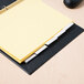 A yellow file folder with Avery clear dividers inside.