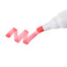 A Universal chisel tip dry erase marker in pink being used to write the letter 'm' on a white surface.