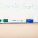 A whiteboard with "weekly goals" written in green using Universal Chisel Tip Dry Erase Markers.