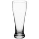 An Acopa clear Pilsner glass on a white background.