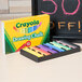 A box of Crayola drawing chalk with 12 colorful sticks.