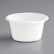 A white EcoChoice bagasse portion cup with a white rim.