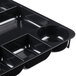 A black Universal plastic drawer organizer with nine sections.